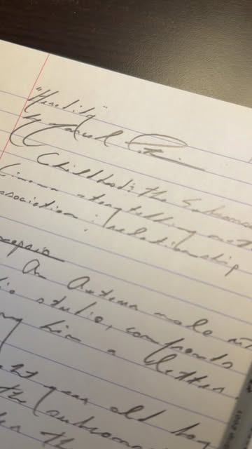 An image of ticket stub, pen and text.